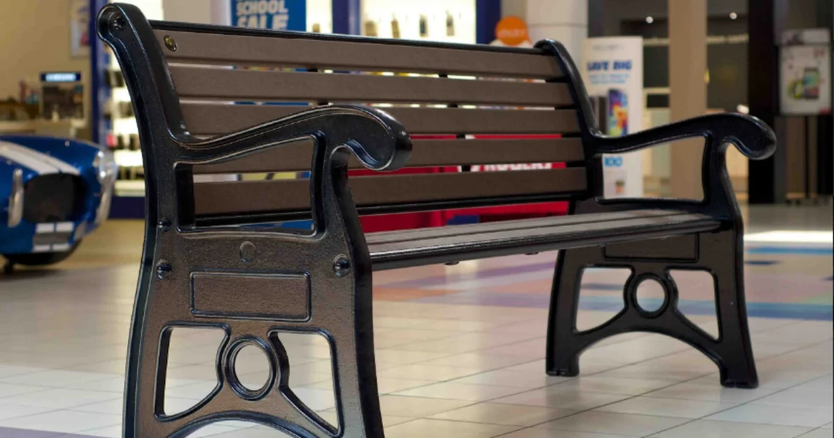 Stylish indoor bench in a mall setting.